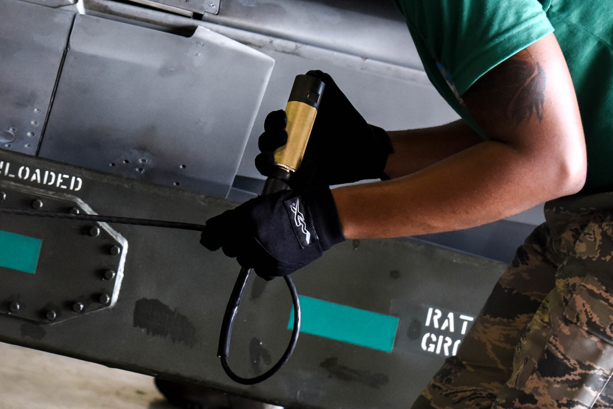 Senior Airman Terrence Jackson, assigned to the 2nd Munitions, guides a trailer around a missile rotator as part of a challenge in Air Force Global Strike Challenge on Barksdale Air Force Base, La., June 12, 2017. Four airmen prepared a missile rotator in under 10 minutes to be competitive against other bases in this challenge  (U.S. Air Force Photo/Airman 1st Class Sydney Bennett)