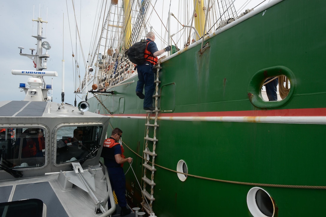 U.S. Coast Guard Marine Safety Detachment Boston officers join Customs and Border Patrol officers to perform an inspection of the German tall ship Alexander von Humbolt II before it enters Boston Harbor June 16, 2017. 