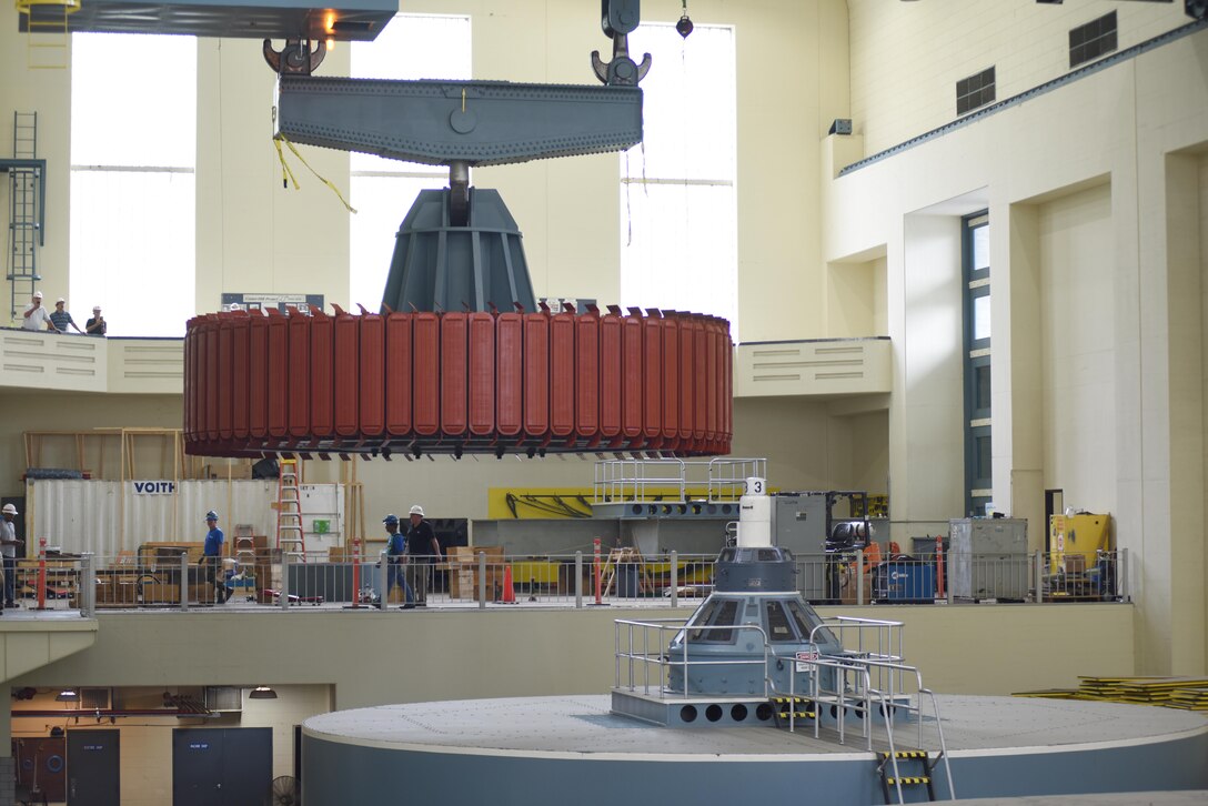 A crane moves a 249-ton rotor for its installation into hydropower unit two at Center Hill Dam in Lancaster, Tenn., June 19, 2017. The U.S. Army Corps of Engineers Nashville District is rehabilitating the unit and expects to bring it online in late July after the completion of its assembly and load testing. 