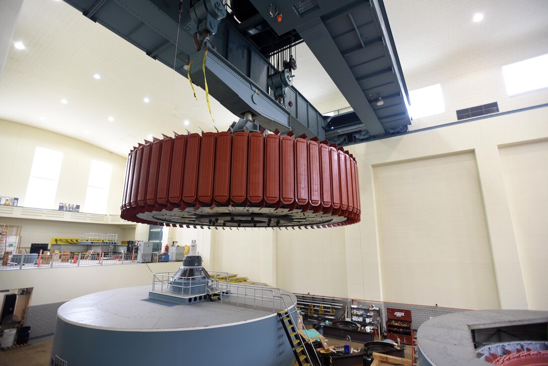 A crane moves a 249-ton rotor for its installation into hydropower unit two at Center Hill Dam in Lancaster, Tenn., June 19, 2017. The U.S. Army Corps of Engineers Nashville District is rehabilitating the unit and expects to bring it online in late July after the completion of its assembly and load testing. 