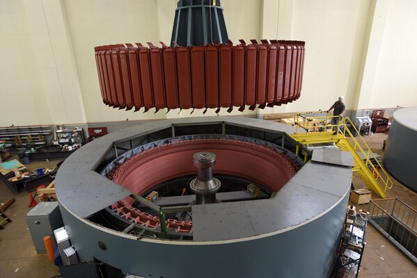 Kye Moss of Voith Hydro guides a 249-ton rotor during its installation into hydropower unit two at Center Hill Dam in Lancaster, Tenn., June 19, 2017. The U.S. Army Corps of Engineers Nashville District is rehabilitating the unit and expects to bring it online in late July after the completion of its assembly and load testing.