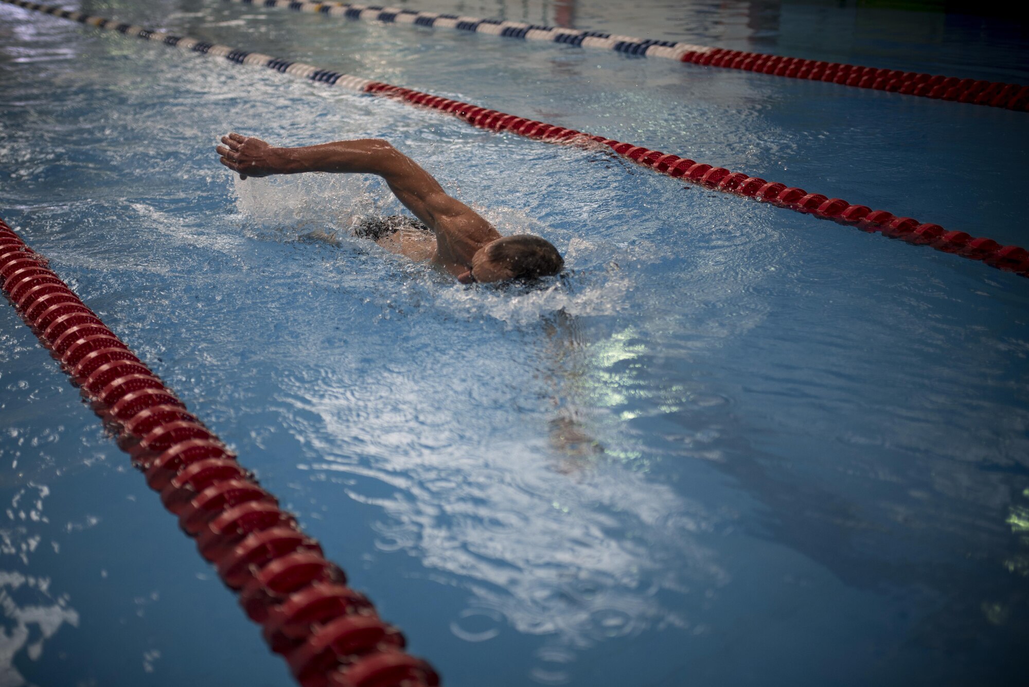 PETERSON AIR FORCE BASE, Colo. – A member of Team Pete finishes a freestyle race during the swimming portion of Sports and Field Day, June 15, 2017, at Peterson Air Force Base, Colo. Freestyle races included the 50 meter, 100 meter, 150 meter and the 200 meter. (U.S. Air Force photo by Senior Airman Dennis Hoffman)