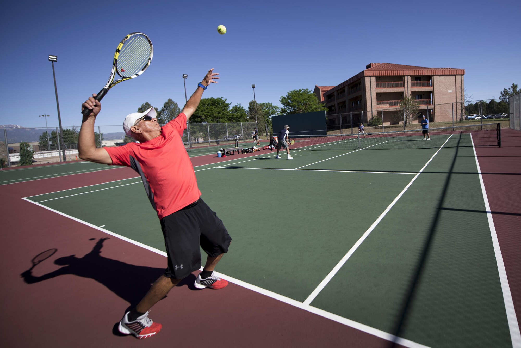 PETERSON AIR FORCE BASE, Colo. – Members of Team Pete battle for match point during a tennis match for Sports and Field Day, June 15, 2017, at Peterson Air Force Base, Colo. The main focus of the day was to promote camaraderie, a sense of cohesion amongst all the units and to provide a day away from the stresses of the work environment. (U.S. Air Force photo by Senior Airman Dennis Hoffman)