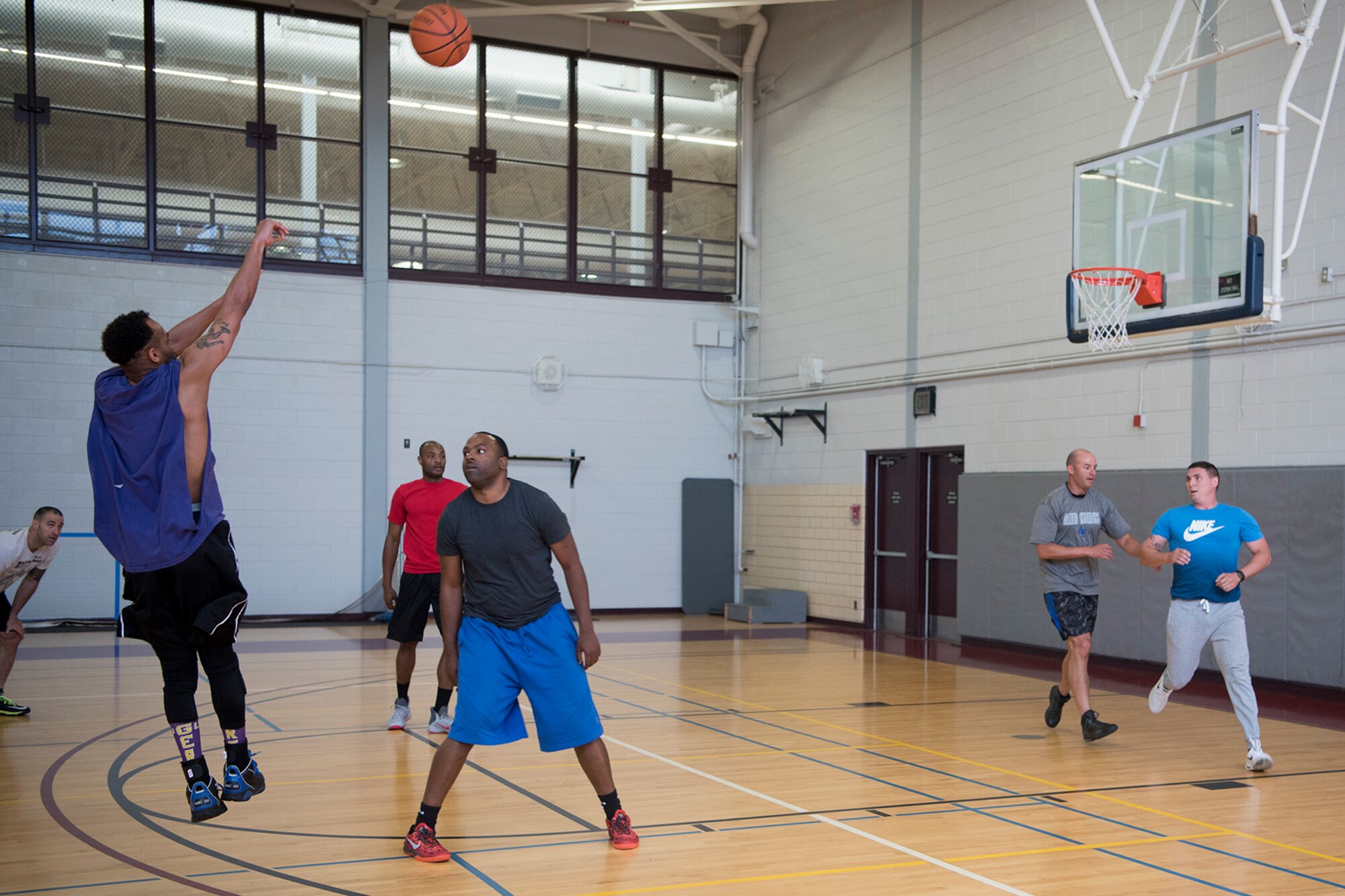PETERSON AIR FORCE BASE, Colo. - Team Pete Airmen participate in a basketball game at the fitness center during the Sports and Field Day, June 15, 2017, at Peterson Air Force Base, Colo. Sports and Field day is a morale building day which gives the units of Team Pete the chance to compete with each other across a multitude of sports and activities. (U.S. Air Force photo by Steve Kotecki)