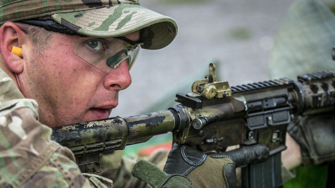 A soldier competes in a timed marksmanship challenge during the Best Three-Soldier Competition at Camp Bondsteel, Kosovo, June 17, 2017. The soldier is assigned to Multinational Battle Group-East. The competition tested soldiers’ mental endurance, physical fitness and knowledge of basic first-aid skills. Army photo by Spc. Adeline Witherspoon