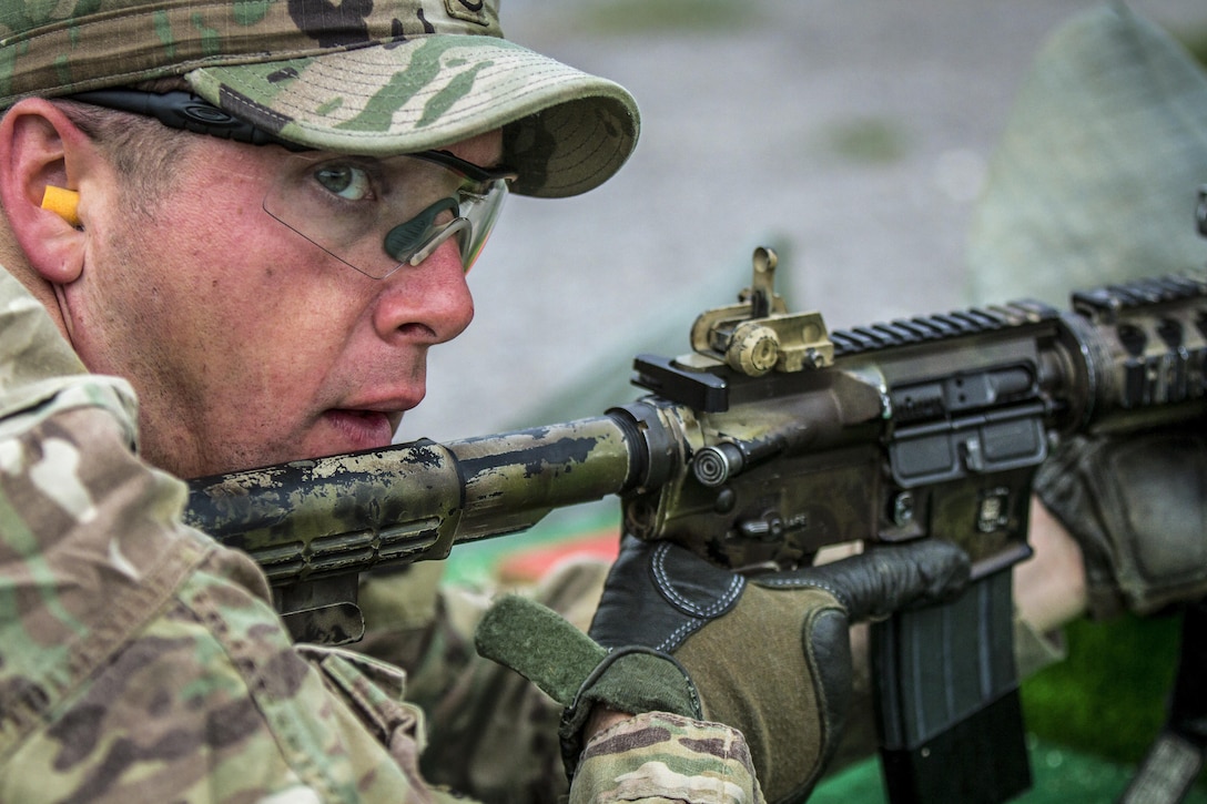 A soldier competes in a timed marksmanship challenge during the Best Three-Soldier Competition at Camp Bondsteel, Kosovo, June 17, 2017. The soldier is assigned to Multinational Battle Group-East. The competition tested soldiers’ mental endurance, physical fitness and knowledge of basic first-aid skills. Army photo by Spc. Adeline Witherspoon