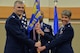 Lt. Col. Deborah Davidson, right, accepts command of the 341st Medical Operations Squadron from Col. Craig Forcum, 341st Medical Group commander, during a change of command ceremony at the Malmstrom Air Force Base Grizzly Bend June 20, 2017. Master Sgt. Kamau Joseph, 341st MDOS superintendent, looks on. (U.S. Air Force photo/Airman 1st Class Daniel Brosam)