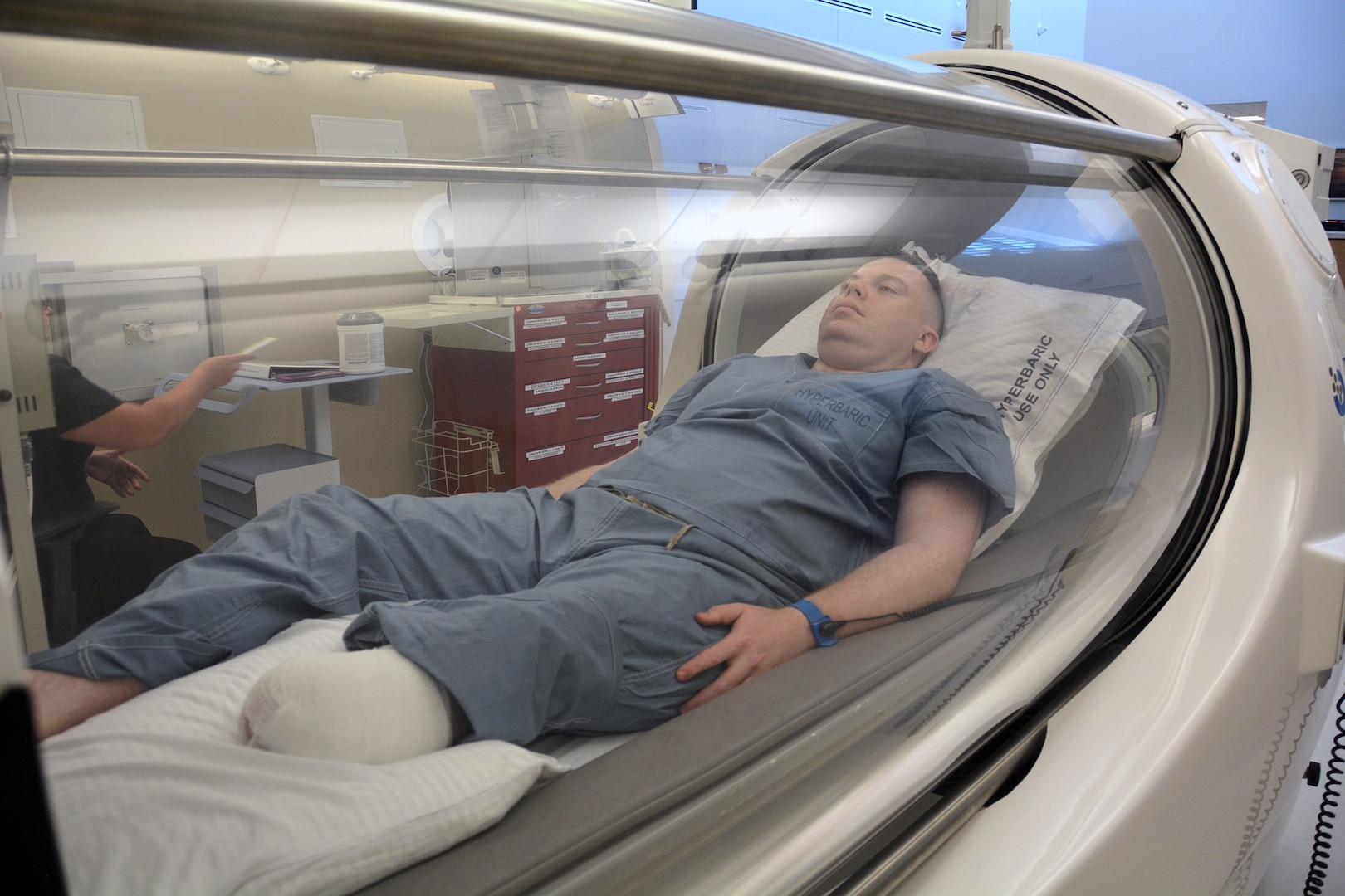 Army Capt. Kyle Salik is the first patient to receive oxygen therapy at the new Undersea & Hyperbaric Medicine Clinic at Brooke Army Medical Center at Joint Base San Antonio-Fort Sam Houston June 20. Hyperbaric oxygen can be used to treat 14 different indicators including wound healing. 