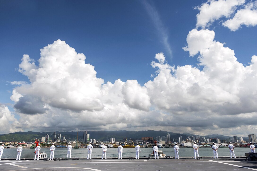 Sailors man the rails aboard the USS Coronado while pulling into Cebu, Philippines, June 19, 2017, for Maritime Training Activity Sama Sama. The Coronado is patrolling the region's littorals and working hull-to-hull with partner navies to provide the 7th Fleet with the flexible capabilities it needs now and in the future. Navy photo by Petty Officer 3rd Class Deven Leigh Ellis