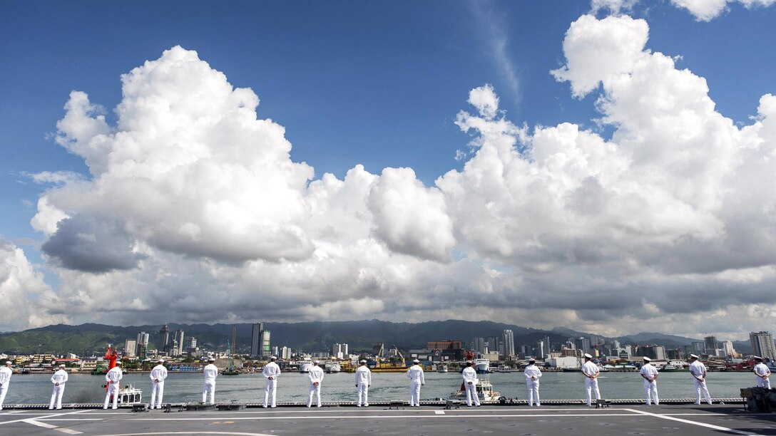 Sailors man the rails aboard the USS Coronado while pulling into Cebu, Philippines, June 19, 2017, for Maritime Training Activity Sama Sama. The Coronado is patrolling the region's littorals and working hull-to-hull with partner navies to provide the 7th Fleet with the flexible capabilities it needs now and in the future. Navy photo by Petty Officer 3rd Class Deven Leigh Ellis