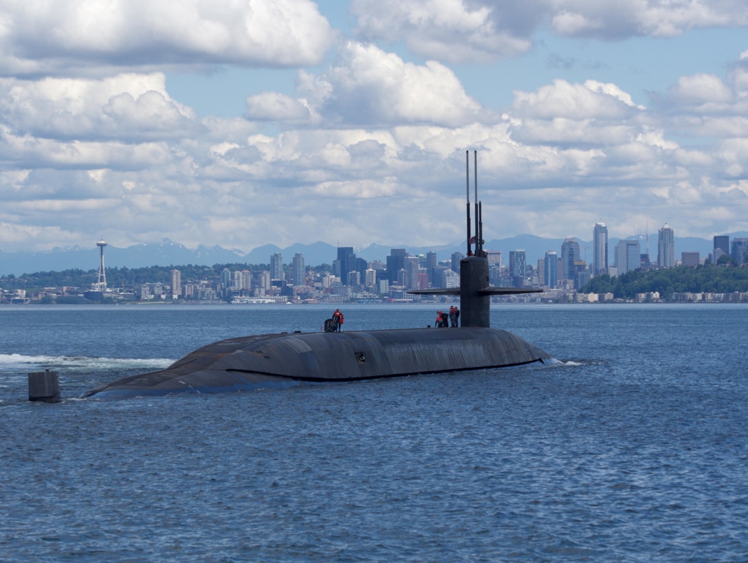 The ballistic-missile submarine USS Nebraska passes by Seattle during sea trials after completing an extended major maintenance period, to include an engineered refueling overhaul at Puget Sound Naval Shipyard and Intermediate Maintenance Facility. Navy photo by Seaman Joseph W. Weiser