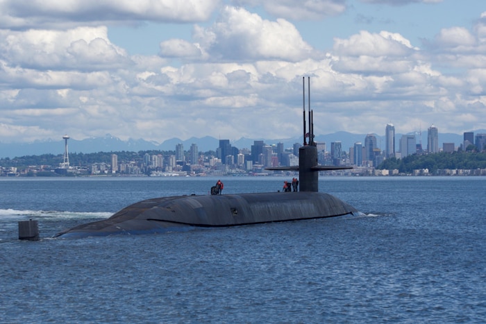The ballistic-missile submarine USS Nebraska passes by Seattle during sea trials after completing an extended major maintenance period, to include an engineered refueling overhaul at Puget Sound Naval Shipyard and Intermediate Maintenance Facility. Navy photo by Seaman Joseph W. Weiser