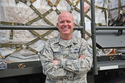 Technical Sgt. Jonathan Rasmussen, small air terminal section chief at Joint Task Force-Bravo, poses for a photograph as his day begins at Soto Cano Air Base, June 13, 2017. His call to duty includes supporting a weekly rotating mission in which a C130 aircraft brings in supplies such as food and medication from Charleston Air Force Base. These supplies go to the dining facility and other entities at JTF-Bravo to ensure that all service members’ needs are covered.
