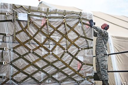 Technical Sgt. Jonathan Rasmussen, small air terminal section chief at Joint Task Force-Bravo, checks cargo that has been received at Soto Cano Air Base, June 13, 2017. His call to duty recently involved a KC-10 aircraft that arrived with humanitarian cargo and also 767 airplane that transported the Special Purpose Marine Air ground Task Force-Southern Command.