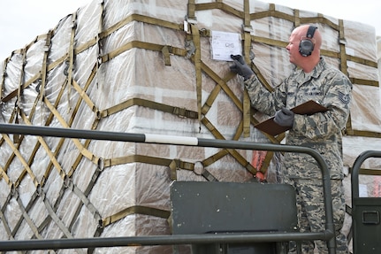 Technical Sgt. Jonathan Rasmussen, small air terminal section chief at Joint Task Force-Bravo, checks cargo that has been received at Soto Cano Air Base, June 13, 2017. His call to duty recently involved a KC-10 aircraft that arrived with humanitarian cargo and also 767 airplane that transported the Special Purpose Marine Air ground Task Force-Southern Command.