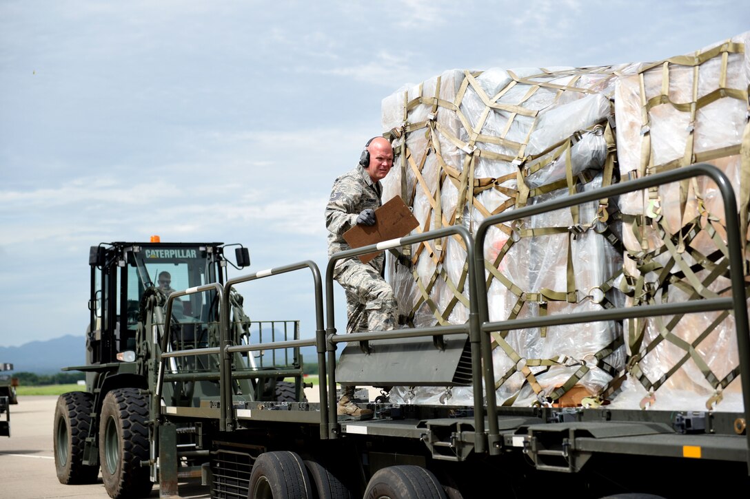 Technical Sgt. Jonathan Rasmussen, small air terminal section chief at Joint Task Force-Bravo, inspects cargo that has been received at Soto Cano Air Base, June 13, 2017. His call to duty includes supporting the Denton Cargo mission in which humanitarian supplies are sent to countries in need. His duties also support service member rotations as his team receives their cargo and new personnel upon arrival to Soto Cano Air Base.