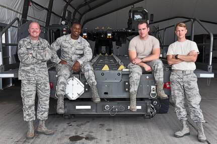 Technical Sgt. Jonathan Rasmussen (far left), small air terminal section chief at Joint Task Force-Bravo, poses for a photograph with his teammates at Soto Cano Air Base, June 13, 2017. Their call to duty includes supporting the Denton Cargo mission, in which humanitarian supplies are sent to countries in need through the U.S. Agency for International Development, support to service member rotations as by receiving cargo and new personnel upon arrival to Soto Cano Air Base, as well as supporting a weekly rotating mission in which a C130 aircraft brings in supplies such as food and medication from Charleston Air Force Base. These supplies go to the dining facility and other entities at JTF-Bravo to ensure that all service members’ needs are covered.