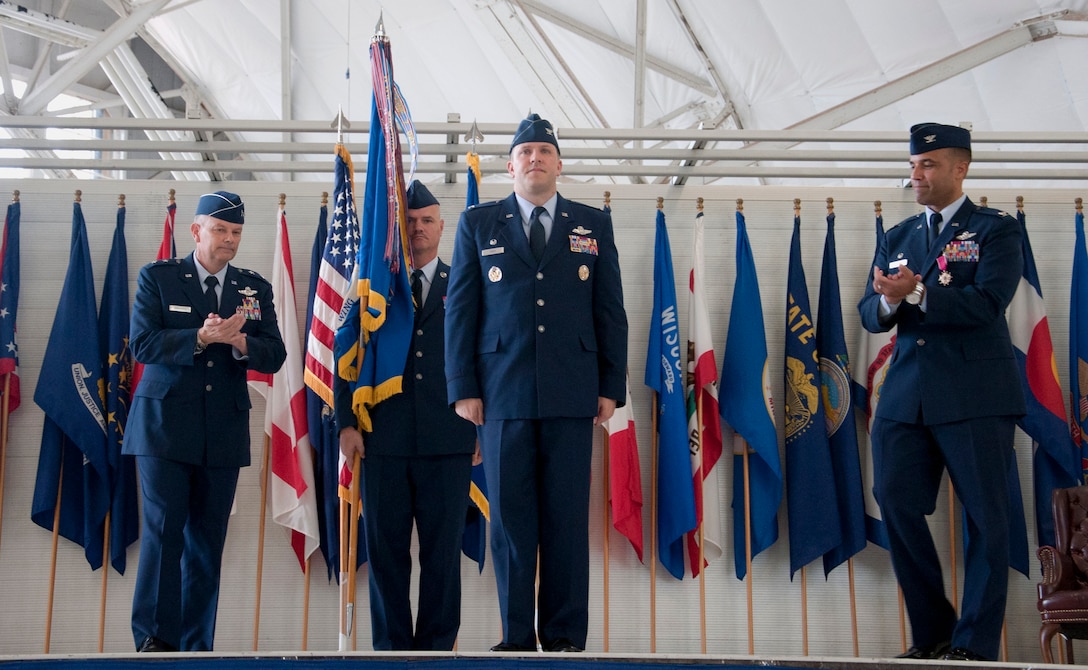 Maj. Gen. Glen VanHerck, Air Force Warfare Center commander (left) and Col. Adrian Spain, outgoing 53rd Wing commander (far right), congratulate Col. David Abba (center), the new 53rd Wing commander June 20 at Eglin Air Force Base, Fla.  Abba previously served here from Jan. 2004 through June 2006 as a member of the 58th Fighter Squadron, 33rd Fighter Wing. (U.S. Air Force courtesy photo/Master Sgt. Jamie Munn) 




