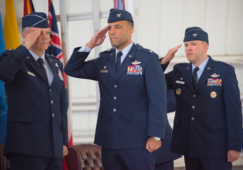 Maj. Gen. Glen VanHerck, Air Force Warfare Center commander, Col. Adrian Spain, outgoing 53rd Wing commander, and Col. David Abba, the new 53rd Wing commander, salute the Colors during the National Anthem June 20 at Eglin Air Force Base, Fla. Abba assumed command of the 53rd Wing from Spain during the ceremony. (U.S. Air Force photo/Ilka Cole)
