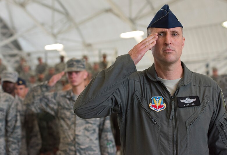 Col. Mark Pye, 53rd Wing vice commander, leads the formation of Airmen in salute of the new 53rd Wing Commander Col. David Abba, during a change of command ceremony June 20 at Eglin Air Force Base, Fla. The first salute rendered is a tradition to honor the new commander upon their assumption of the command. (U.S. Air Force photo/Ilka Cole) 

