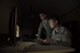 U.S. Air Force Senior Airman Joseph Goebel, left, and Airman 1st Class Anthony Ohara, right, both 35th Operations Support Squadron weather forecasters, analyze climate patterns during RED FLAG-Alaska 17-2 at Eielson Air Force Base, Alaska, June 16, 2017. Goebel and Ohara were in charge of running the weather flight for RF-A, which consisted of seven other Air National Guardsman from Joint Base Lewis-McChord, Washington. (U.S. Air Force photo by Airman 1st Class Sadie Colbert)