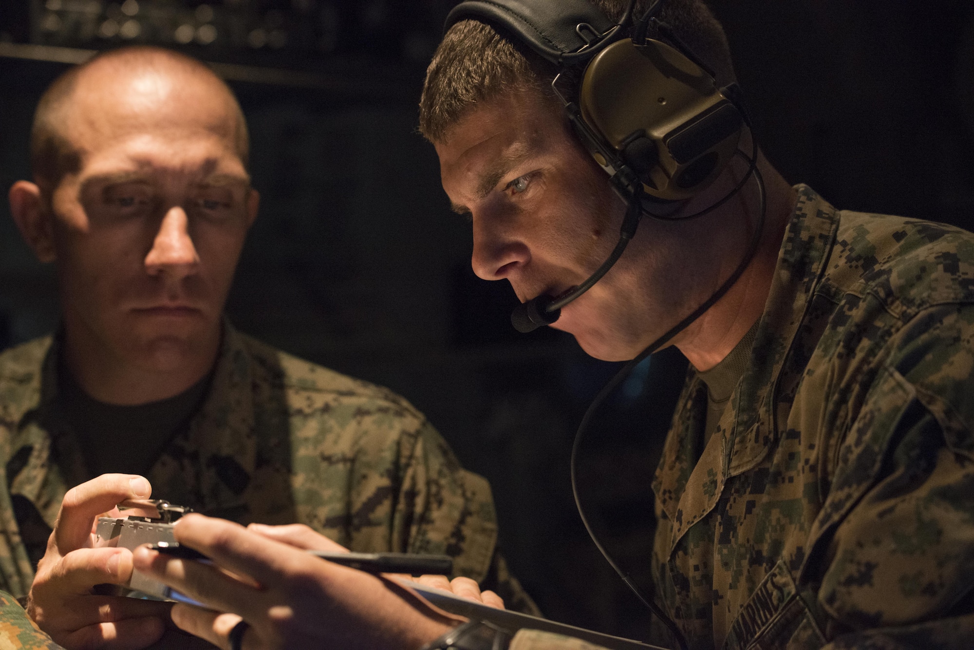 U.S. Marine Corps 12th Marine Regiment, 3rd Marine Division operators establish radio communication prior to the rapid infiltration of a High Mobility Artillery Rocket System (HIMARS) from a U.S. Air Force Special Operations Command MC-130J Commando II assigned to the 353rd Special Operations Group, June 1, 2017 at Kunsan Air Base, Republic of Korea. HIMARS’ precision fires technology and the specialized aviation provided by the MC-130J delivers a strategic capability for crisis response in the Pacific. (U.S. Air Force photo by Capt. Jessica Tait)