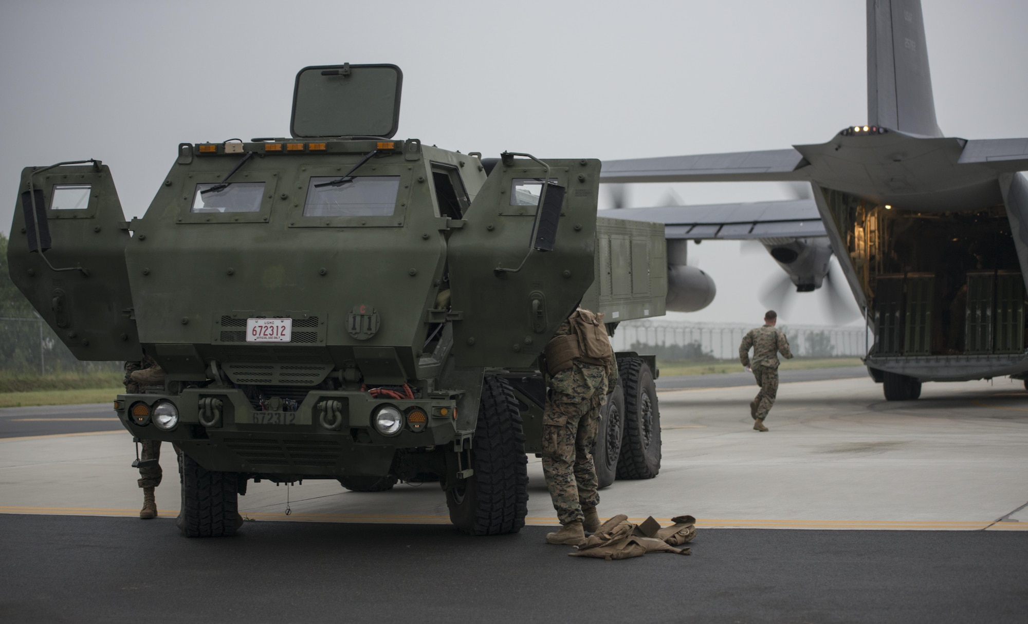 U.S. Marine Corps 12th Marine Regiment, 3rd Marine Division operators offload a High Mobility Artillery Rocket System (HIMARS) from a U.S. Air Force Special Operations Command MC-130J Commando II assigned to the 353rd Special Operations Group during a readiness drill, June 1, 2017 at Kunsan Air Base, Republic of Korea. HIMARS’ precision fires technology and the specialized aviation provided by the MC-130J delivers a strategic capability for crisis response in the Pacific. (U.S. Air Force photo by Capt. Jessica Tait)