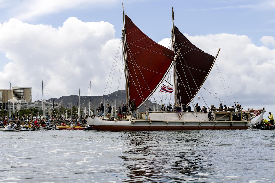 The traditional Polynesian double-hulled voyaging canoe Hokule‘a returns to Honolulu, June 17, 2017, from a 36-month tour around the world. The Hokuleʻa sailed more than 40,000 nautical miles using only star navigation to spread the message of Malama Honua, or caring for the Earth, to 85 ports and 26 nations. Navy Photo by Petty Officer 2nd Class Gabrielle Joyner