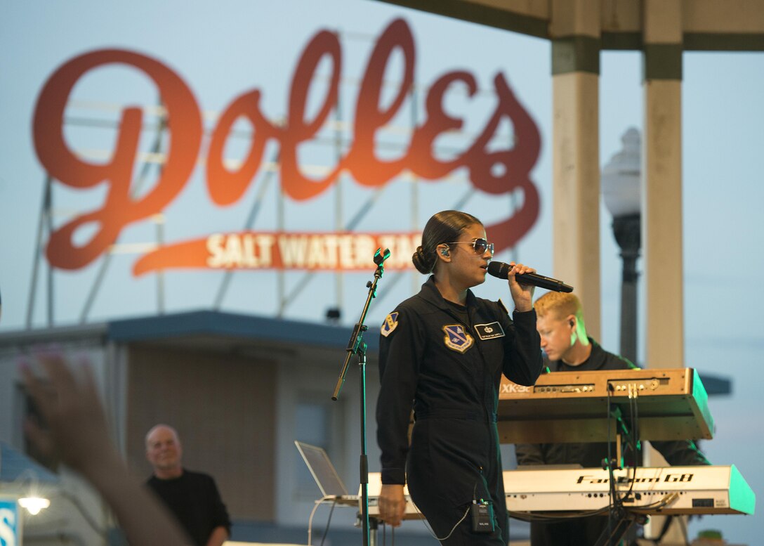 Tech. Sgt. Nalani Quintello, Max Impact vocalist, sings during a concert June 17, 2017, at the Rehoboth Beach Bandstand, in Rehoboth Beach, Del. Prior to joining the Air Force, Quintello was a contestant on the popular television show, "American Idol." (U.S. Air Force photo by Senior Airman Zachary Cacicia)