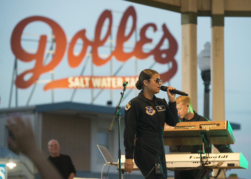 Tech. Sgt. Nalani Quintello, Max Impact vocalist, sings during a concert June 17, 2017, at the Rehoboth Beach Bandstand, in Rehoboth Beach, Del. Prior to joining the Air Force, Quintello was a contestant on the popular television show, "American Idol." (U.S. Air Force photo by Senior Airman Zachary Cacicia)