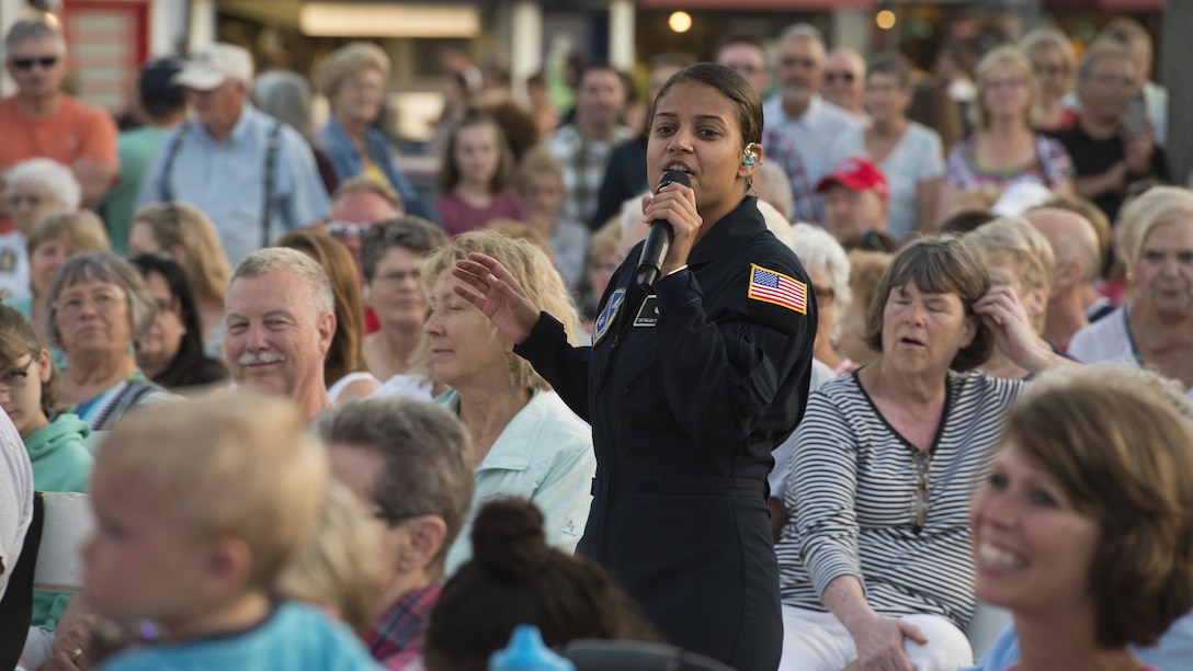Tech. Sgt. Nalani Quintello, Max Impact vocalist, sings during a concert June 17, 2017, at the Rehoboth Beach Bandstand, in Rehoboth Beach, Del. This six-piece band performs classic and current rock and country hits, as well as patriotic favorites and original music. (U.S. Air Force photo by Senior Airman Zachary Cacicia)