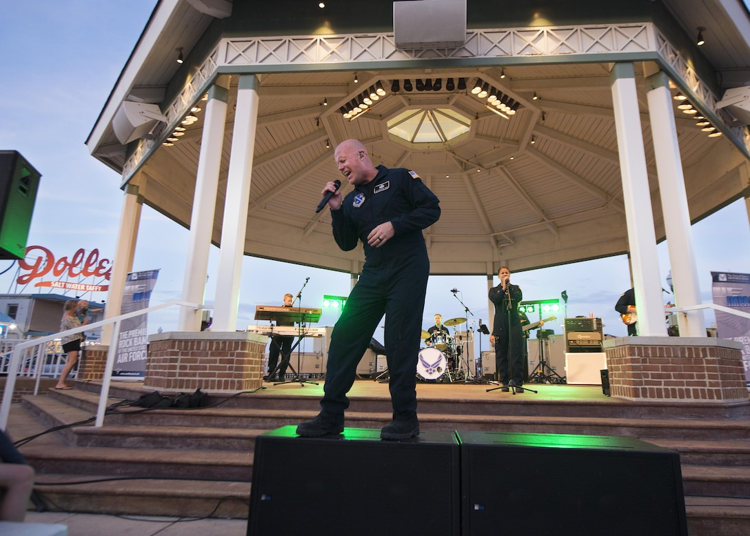 Senior Master Sgt. Ryan Carson, Max Impact vocalist and superintendent, sings during a concert June 17, 2017, at the Rehoboth Beach Bandstand, in Rehoboth Beach, Del. Max Impact is stationed out of Joint Base Anacostia-Bolling in Washington, D.C. (U.S. Air Force photo by Senior Airman Zachary Cacicia)