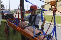 U.S. Air Force Senior Airman Donavin Apiag, 8th Civil Engineer Squadron fire emergency services driver/operator assists in lowering a simulated victim during training at Kunsan Air Base, Republic of Korea, June 8, 2017. Apiag participated in the Department of Defense Technical Rescue Course, which taught students from the Pacific Air Forces region high and low angle, confined space, and technical rope rescues. (U.S. Air Force photo by Senior Airman Michael Hunsaker/Released)