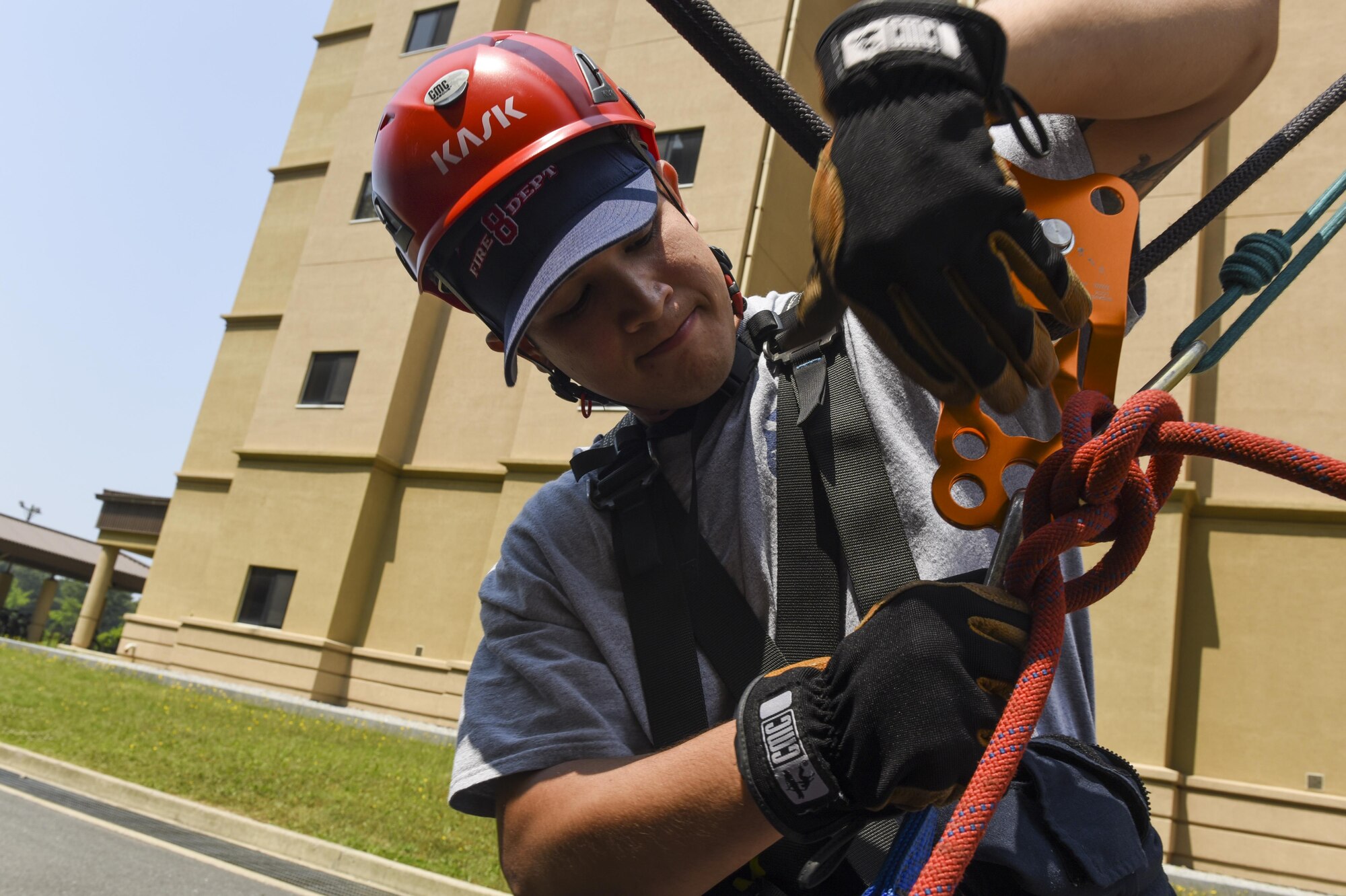 U.S. Air Force Senior Airman Donavin Apiag, 8th Civil Engineer Squadron fire emergency services driver/operator unhooks a Stokes basket after lowering it during training at Kunsan Air Base, Republic of Korea, June 8, 2017. Apiag participated in the Department of Defense Technical Rescue Course which taught students from the Pacific Air Forces region high and low angle, confined space, and technical rope rescues. (U.S. Air Force photo by Senior Airman Michael Hunsaker/Released)