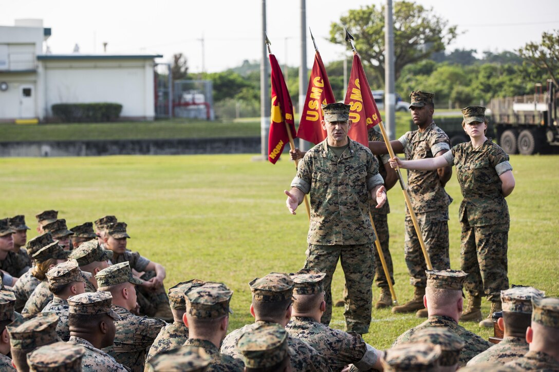 U.S. Marine Corps Col. George G. Malkasian, Commanding Officer of Headquarters Battalion, 3d Marine Division, speaks to Marines about Marine Corps’ customs and courtesies and the importance of close order drill at the drill competition at the Courtney Bowl on Camp Courtney, Okinawa, Japan, March 31, 2017. Headquarters Company, Truck Company, and Communications Company engaged in a competition against each other for a drill trophy and to aid in preparation for an upcoming commanding general inspection.  (U.S. Marine Corps photo by MCIPAC Combat Camera Lance Cpl.  Jesus McCloud)