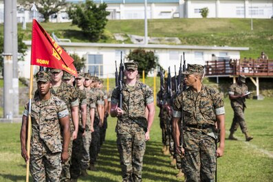 U.S. Marine Corps Sgt. Marquis Rosen, with Communications Company, Headquarters Battalion, 3d Marine Division, conducts the movement “eyes right” during a drill competition at the Courtney Bowl, on Camp Courtney, Okinawa, Japan, March 31, 2017. Headquarters Company, Truck Company, and Communications Company engaged in a competition against each other for a drill trophy and to aid in preparation for an upcoming commanding general inspection.  (U.S. Marine Corps photo by MCIPAC Combat Camera Lance Cpl.  Jesus McCloud)