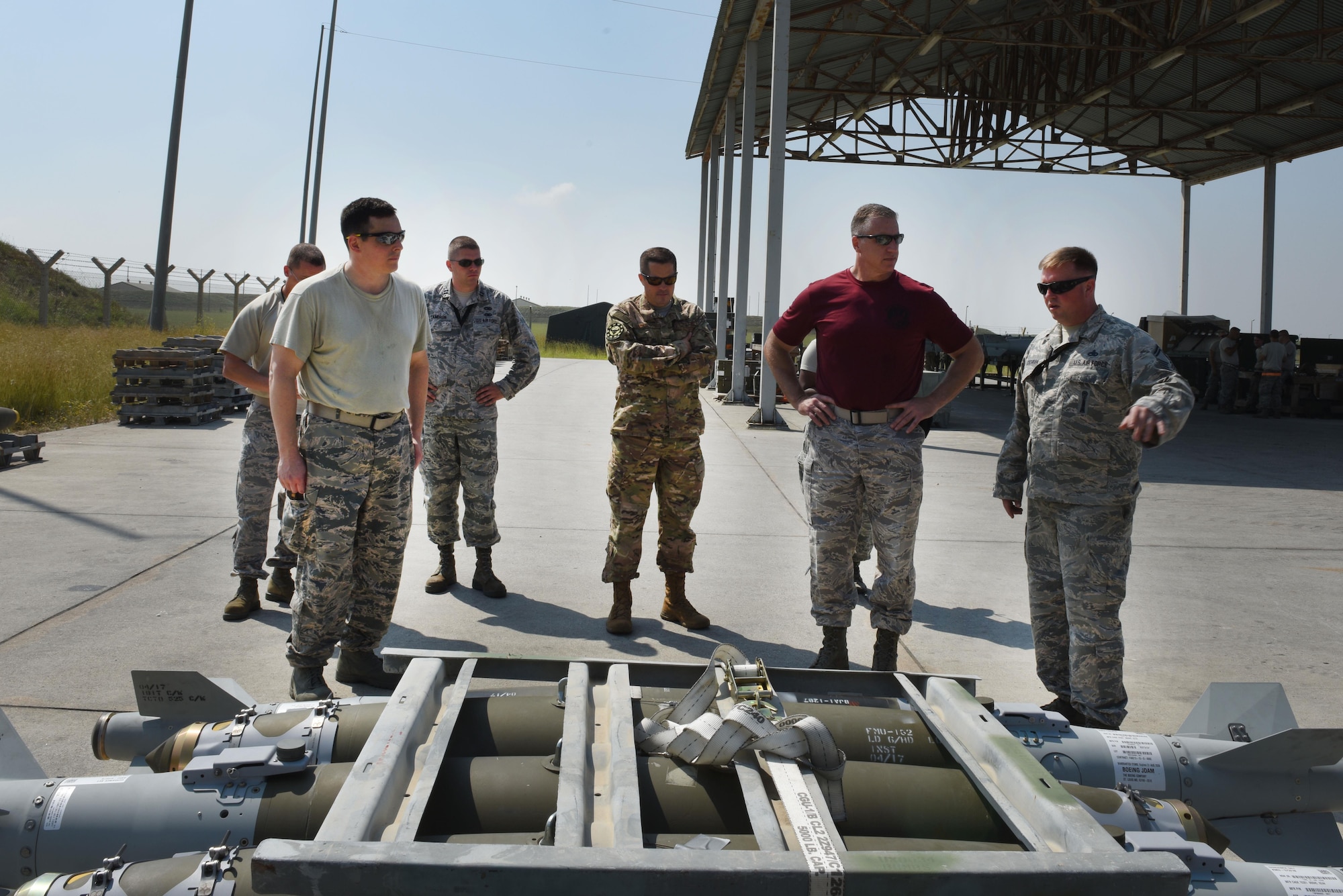 Col. David Eaglin, 39th Air Base Wing commander, is briefed by members of the 447th Expeditionary Aircraft Maintenance Squadron during a munitions build June 16, 2017, at Incirlik Air Base, Turkey. Eaglin built two joint direct attack munition guided bomb unit 31s in order to gain an understanding of the 447th MXS mission. (U.S. Air Force photo by Airman 1st Class Kristan Campbell)