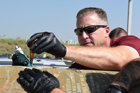 Col. David Eaglin performs maintenance with the 447th Air Expeditionary Wing Munitions Squadron June 16, 2017, at Incirlik Air Base, Turkey. (U.S. Air Force photo by Airman 1st Class Kristan Campbell)