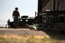 U.S. Air Force Senior Airman Scott Plough, 434th Civil Engineer Squadron explosive ordnance disposal team member, drags a rope during the second annual multilateral Improvised Explosive Device Rodeo at Spangdahlem Air Base, Germany, June 12-16, 2017. During certain scenarios of the event, ropes are attached to door handles and pulled from a safe location, ensuring the member stays unharmed in the event a mock IED is attached to a trigger point in the doorway. (U.S. Air Force photo by Senior Airman Preston Cherry)