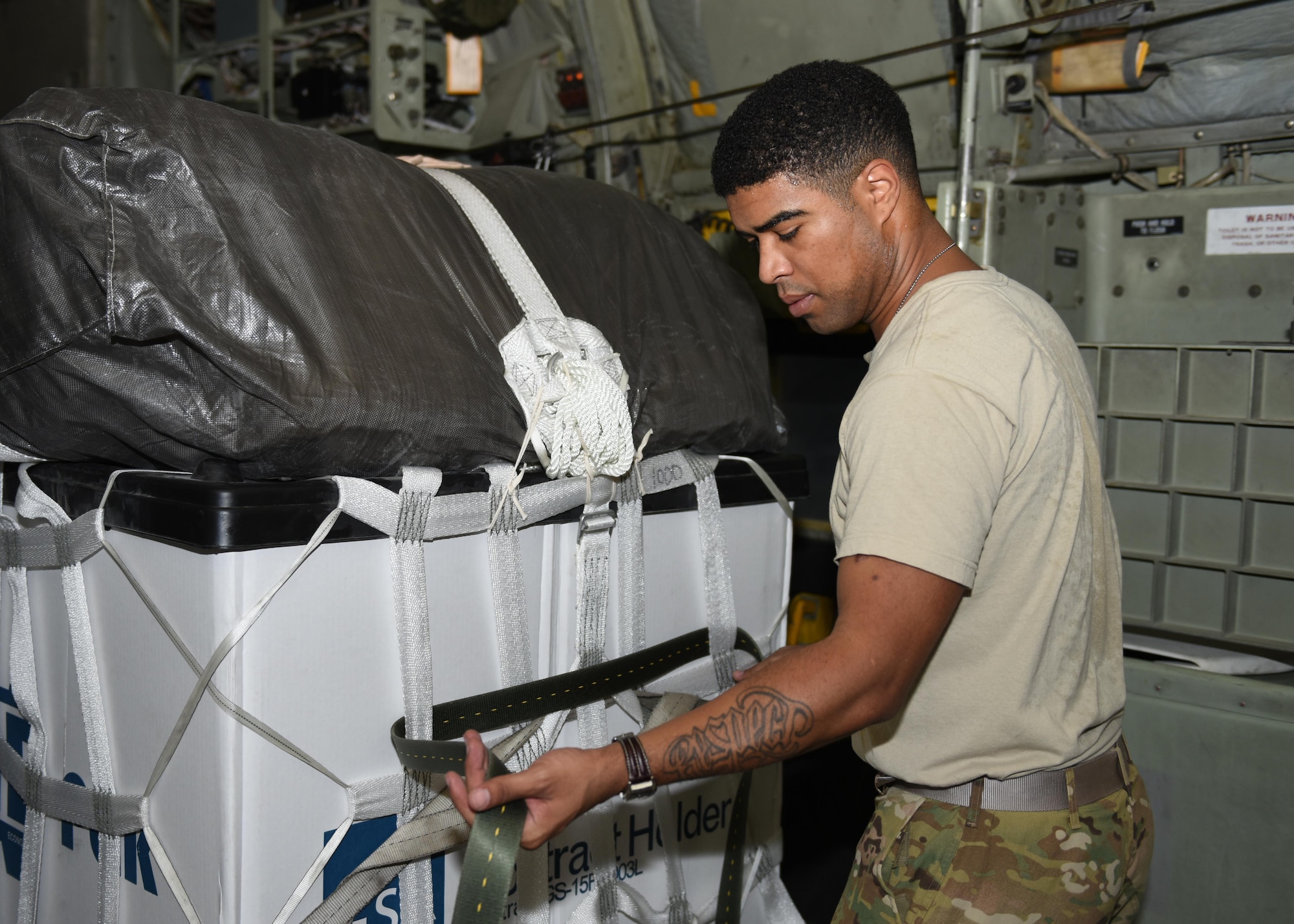 Tech. Sgt. Jimmy Sealey, a loadmaster with the 737th Expeditionary Airlift Squadron, straps down a container delivery system in the cargo bay of a C-130 Hercules in preparation for an air drop at an undisclosed location in Southwest Asia, over the weekend. Providing the fuel that keeps the fight going, the 386th Air Expeditionary Wing has delivered more than 80 tons of food, water and other supplies to various supported forces throughout the U.S. Air Forces Central Command area of responsibility in support of Combined Joint Task Force - Operation Inherent Resolve ground troops. (U.S. Air Force photo/Tech. Sgt. Jonathan Hehnly)