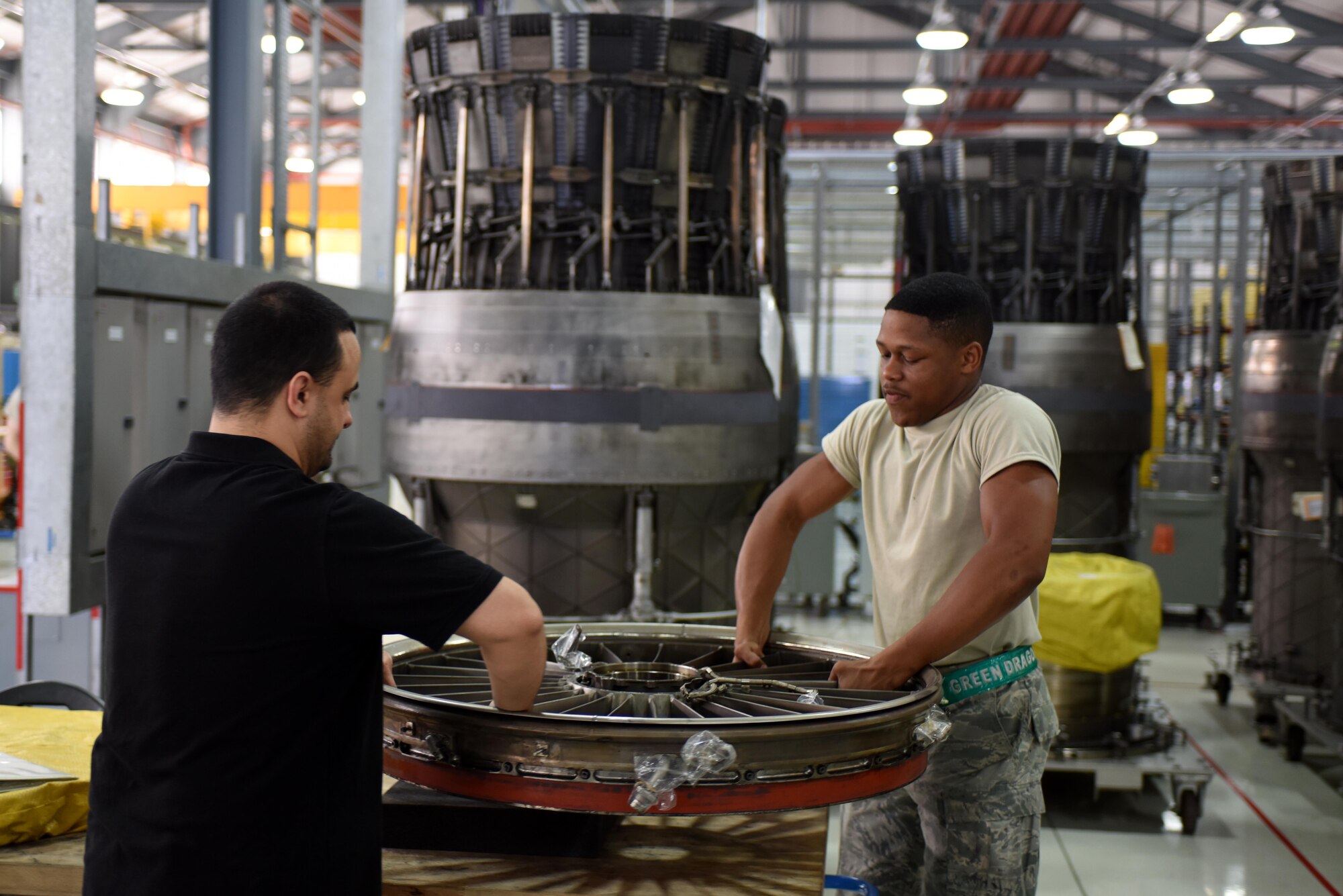 Airmen assigned to the 48th Component Maintenance Squadron remove an inlet case at Royal Air Force Lakenheath, England, June 13. The 48th CMS is responsible for the installation’s propulsions shop, where maintenance is performed on F-15 engines. (U.S. Air Force photo/Airman 1st Class Eli Chevalier)