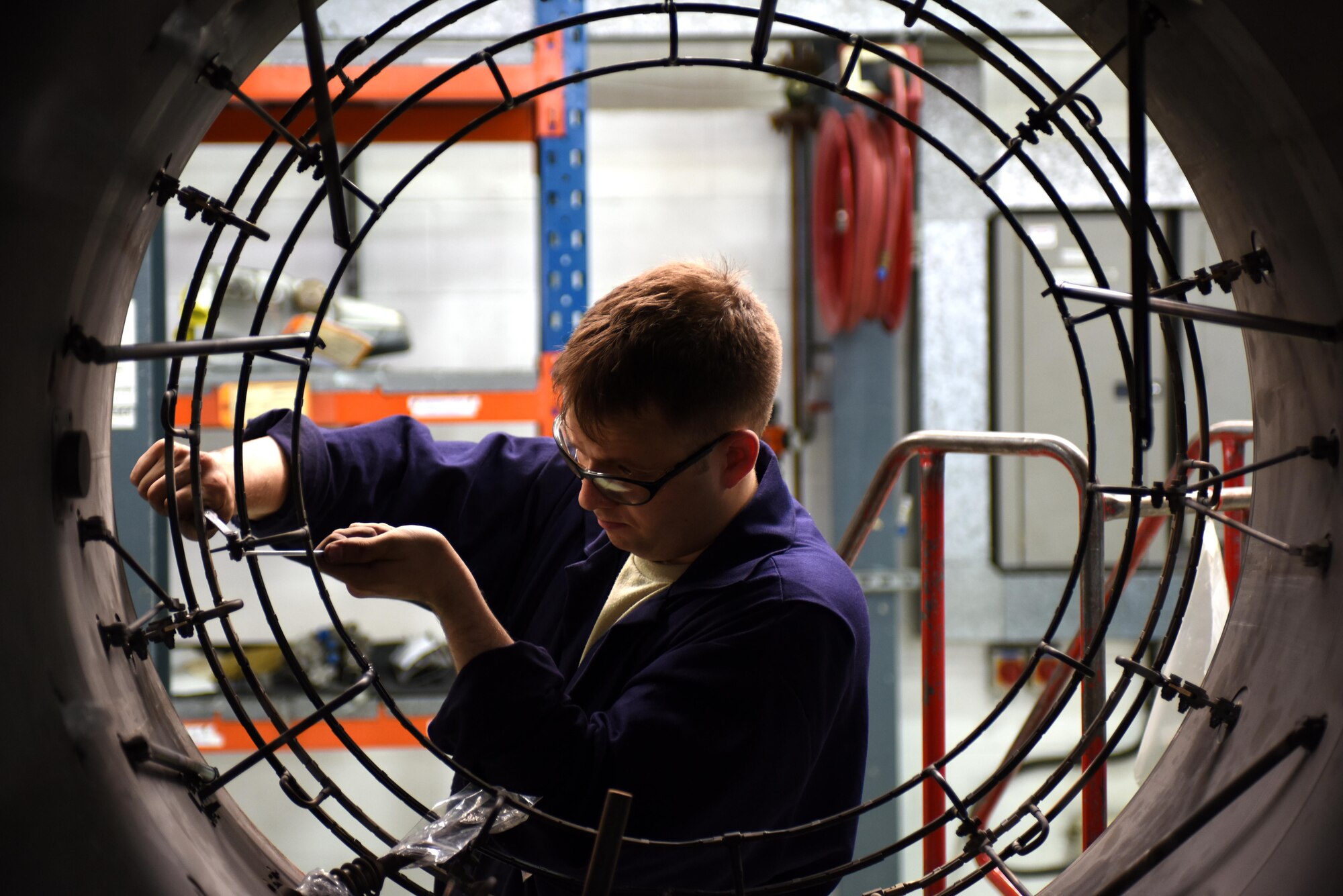 An Airman assigned to the 48th Component Maintenance Squadron performs a duct receiving inspection at Royal Air Force Lakenheath, England, June 13. Part of the 48th CMS’s responsibilities include the routine maintenance of F-15 engines. (U.S. Air Force photo/Airman 1st Class Eli Chevalier)