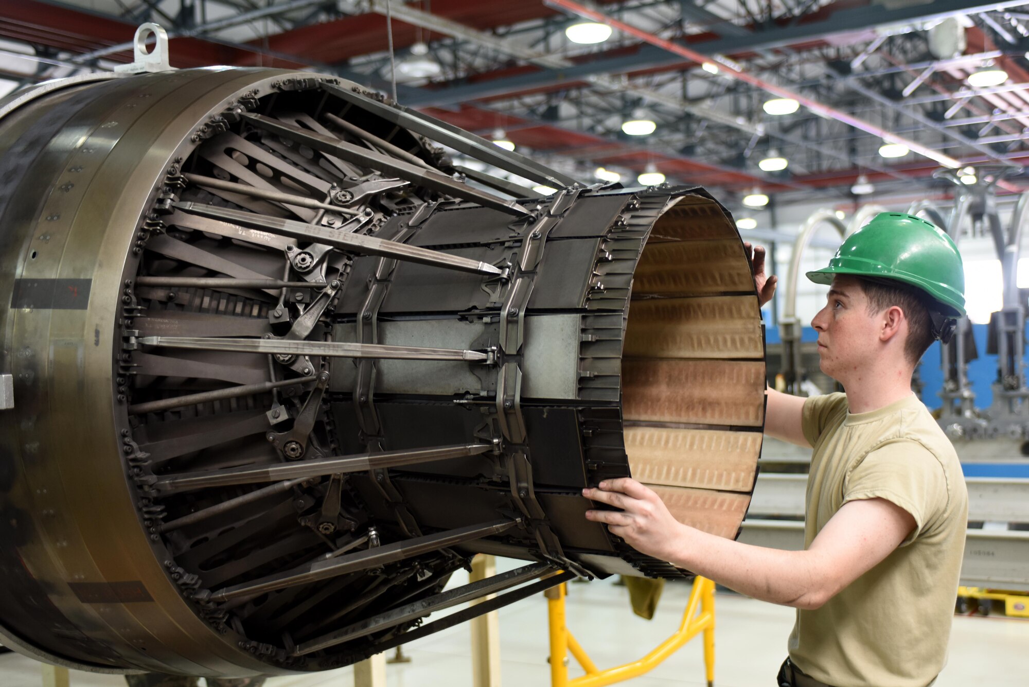 An Airman assigned to the 48th Component Maintenance Squadron maneuvers an F-15 engine at Royal Air Force Lakenheath, England, June 13. The 48th CMS is responsible for the installation’s propulsions shop, where maintenance is performed on F-15 engines. (U.S. Air Force photo/Airman 1st Class Eli Chevalier) 