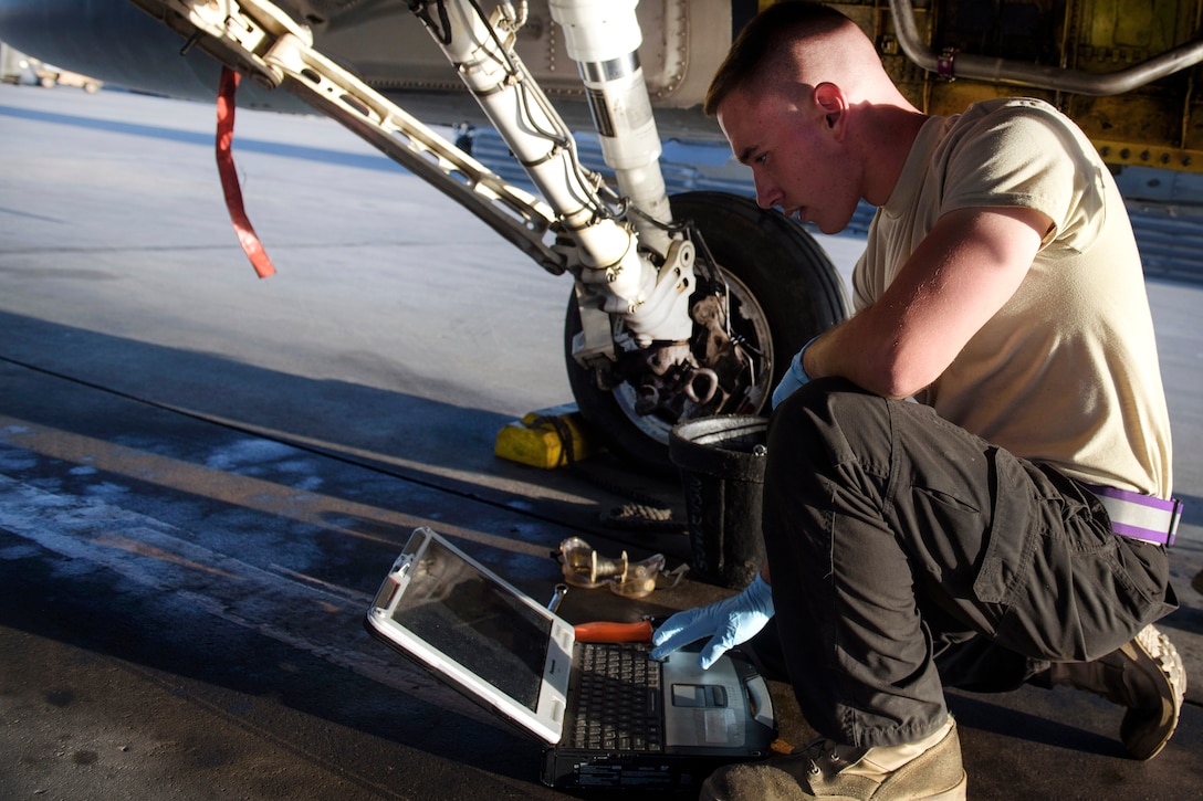 Air Force Senior Airman Brandon Murdaugh reviews a technical order before performing maintenance on an F-16 Fighting Falcon at Bagram Airfield, Afghanistan, June 16, 2017. Murdaugh is a crew chief assigned to the 455th Expeditionary Aircraft Maintenance Squadron. Air Force photo by Staff Sgt. Benjamin Gonsier