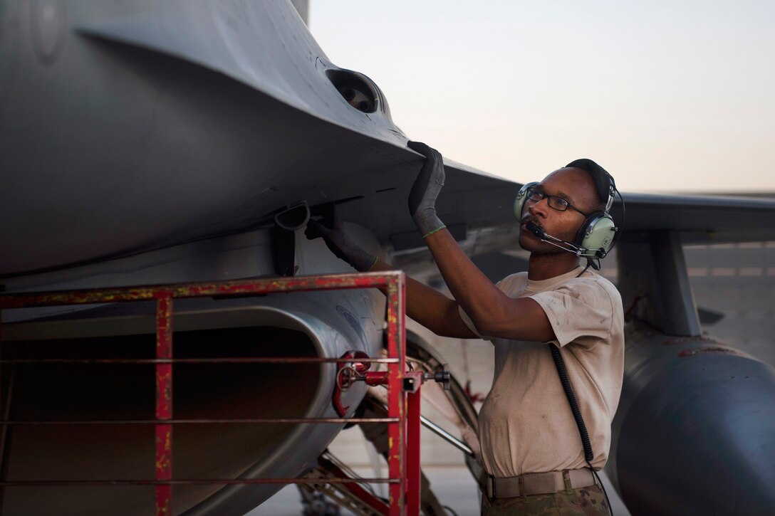 Air Force Staff Sgt. Donterrio Erby performs an inspection of an F-16 Fighting Falcon before conducting an afterburner run at Bagram Airfield, Afghanistan, June 16, 2017. Erby is an aerospace propulsion technician assigned to the 455th Expeditionary Aircraft Maintenance Squadron. Air Force photo by Staff Sgt. Benjamin Gonsier 