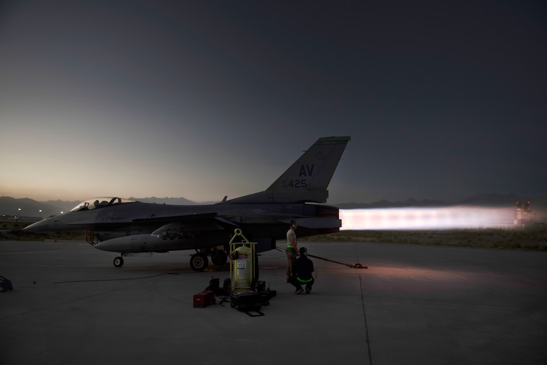 Air Force airmen perform an afterburner run on an F-16 Fighting Falcon at Bagram Airfield, Afghanistan, July 16, 2017. Air Force photo by Staff Sgt. Benjamin Gonsier 