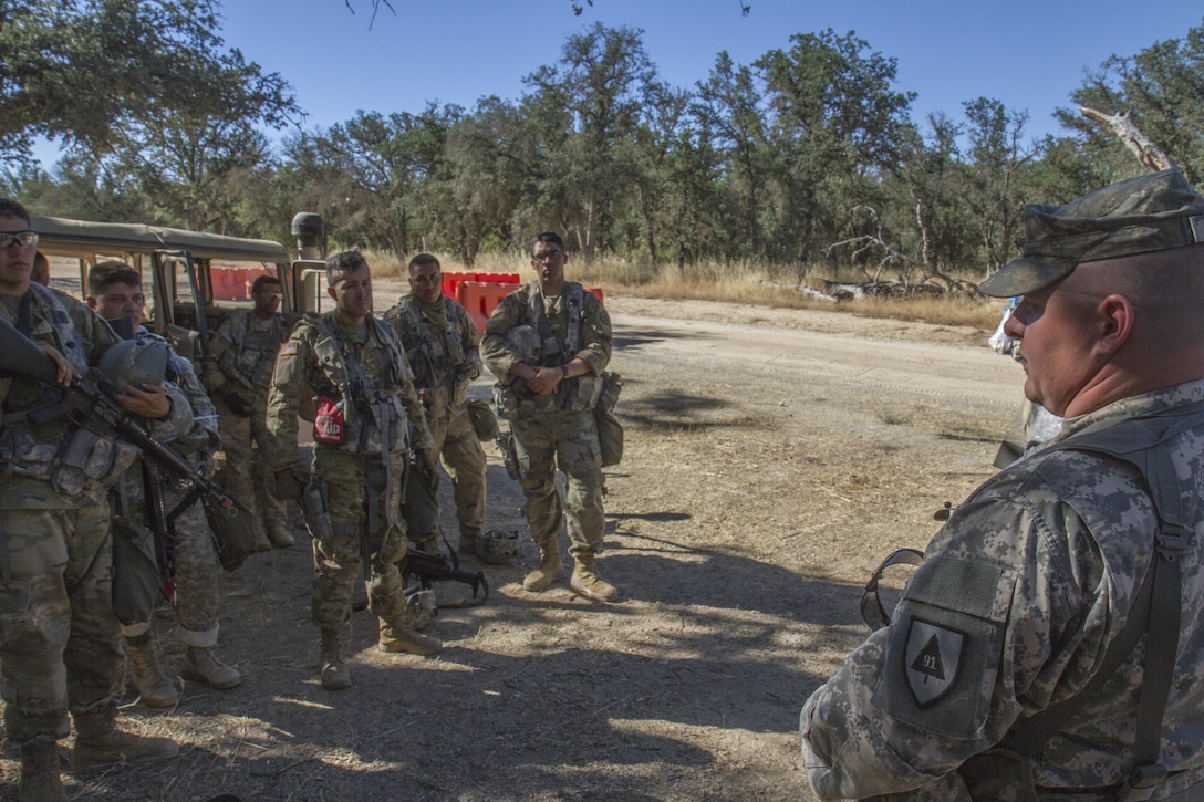 An Observer Controller Training (OCT) from the 91st Training Division conducts an After Action Report during the 91st Training Division’s Warrior Exercise, on Fort Hunter Liggett, Calif. June 15, 2017. The OCT discusses what soldiers felt went good and bad during any training exercise they conduct. (Photo by Spc. Eric Unwin/released)
