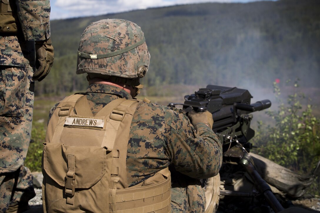 Army Pfc. Hunter Andrews, a machine gunner assigned to Marine Rotational Force Europe 17.1, fires the MK19 40mm automatic grenade launcher during a live-fire range near Stjørdal, Norway, June 8, 2017. The objective was to traverse and engage multiple targets of unknown distances. Marine Corps photo by Cpl. Victoria Ross