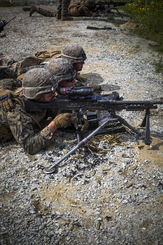 Marines assigned to Marine Rotational Force Europe 17.1 fire an M240B medium machine gun during a live-fire range near Stjørdal, Norway, June 9, 2017. Before setting in on the firing line, Marines completed physical fitness exercises to simulate the physical fatigue felt in combat. The infantry Marines cross-trained on the M240B to gain a basic understanding of the weapon should they ever need to employ one themselves. Marine Corps photo by Cpl. Victoria Ross