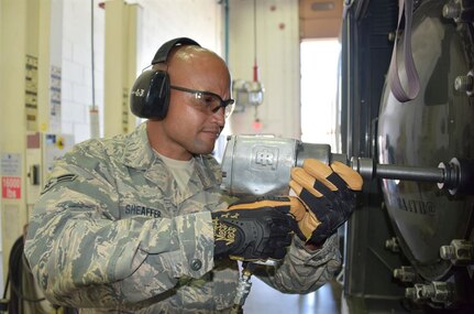 Air Force Airman 1st Class Jonathan Sheaffer removes a bolt from a water separator filter on an R-11 refueling truck at Goldwater Air National Guard Base in Phoenix, May 3, 2017. Sheaffer is a vehicle maintenance apprentice in the Arizona Air National Guard's 161st Air Refueling Wing. 